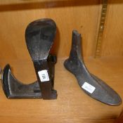 Two antique cast-iron cobblers lasts (on