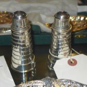 A pair of silver plated salt and pepper