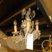 A four branch cut glass chandelier with