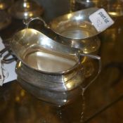 A hallmarked silver salt, silver creamer