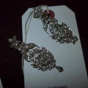 A pair of multi diamond inset floral arr