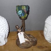 A Tiffany style lamp with reclining lady