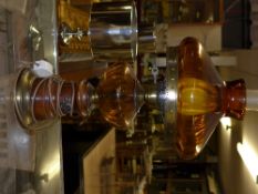 An amber colour glass oil lamp converted