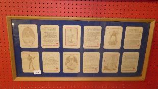 A framed set of sporting beer mats