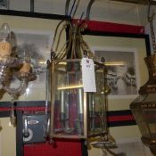 A brass and glass hexagonal hanging lant