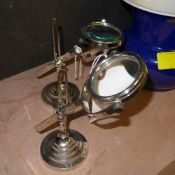 A pair of magnifying glass on stands