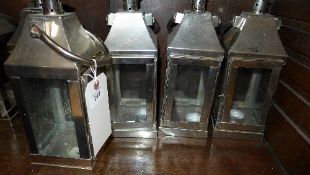 A set of eight chrome and glass hanging