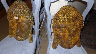 A pair of rustic wall hanging Buddha fac