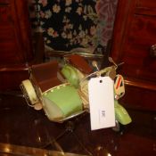 A painted tin model scooter and sidecar