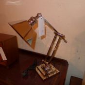 An Art Deco style nickel plated desk lamp on adjustable supports