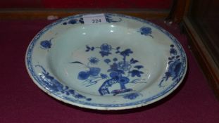 A C19th Chinese blue and white export ware soup bowl made on the mainland decorated with flowers