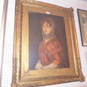 A print portrait of a girl in a gilt frame