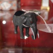 A miniature gold painted bronze elephant form pin cushion