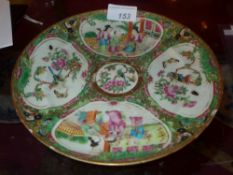 An early C19th Cantonese famille rose export ware plate decorated with pictorial reserve