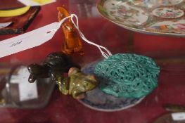 A carved hardwood hare form netsuke together with a soapstone figurine of a tortoise and a pierced