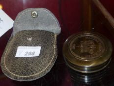 A leather cased compass together with another compass