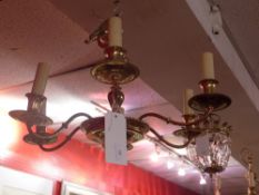 A brass six branch hanging chandelier