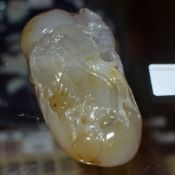 A Chinese agate carving depicting a bearded figure