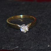 A ladies 9ct gold and diamond solitaire ring