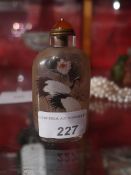 A Chinese inside painted glass snuff bottle painted with water birds