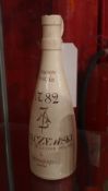 An antique Polish stoneware bottle with hand painted detail J. A. Baczewski