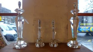 Two lucite table lamps of faceted form and a smaller matching pair