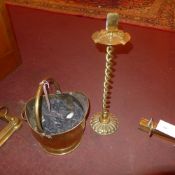 A brass coal scuttle and a brass ashtray on twisted supports
