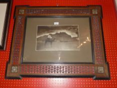 An Arabian black and white photograph within a Syrian frame with inlaid and pierced beaded detail
