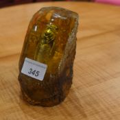 An amber style paperweight
