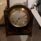A 1920`s Asprey chinoiserie black lacquered mantel clock the dial with Roman numerals and the case