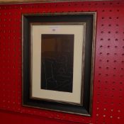 A glazed and framed Eric Gill print after a wood cut nude female study