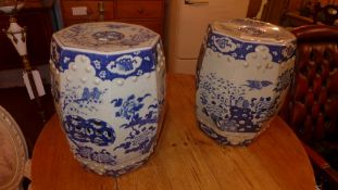A pair of Chinese blue and white barrell form stools decorated with blossom