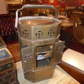 An old brass ships storm lantern with glazed panels