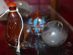 An unusual egg shaped Chinese inside painted snuff bottle decorated with a dragon together with an