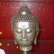 A silver plated Buddha head
