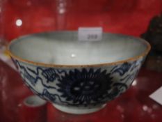 A Chinese Ching period blue and white deep bowl with stylized maker's mark to the base made by a