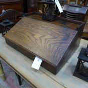 A wooden table top sloping desk unit