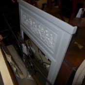 A distressed painted wall hanging mirror
