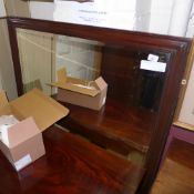 A mahogany wall mirror the bevelled plate in moulded frame