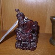 A Japanese carved seated figure
