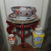 A C19th Japanese Imari scallop form plate, similar bowl and a carved stand