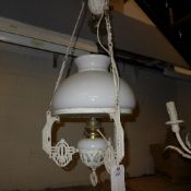 A white painted wrought iron gas lamp (converted) with opaque shade
