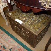 A brass embossed coal box