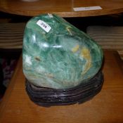 A jadeite boulder on stand