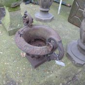 A pair of cast iron campana garden urns