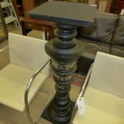 An ebonised and porcelain and porcelain column