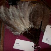 A vintage ostrich feather fan with faux