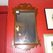 A mahogany fret cut looking glass with r