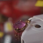 A 6.5 ct pink topaz in a 9 ct gold claw