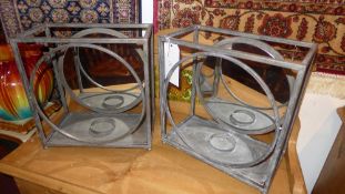 A pair of wrought iron garden candle hol